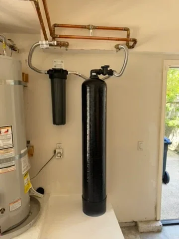 Dual-tank water softener system with copper piping and bypass valve installation